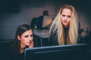 Event Management Software - Two Women Looking at a Computer